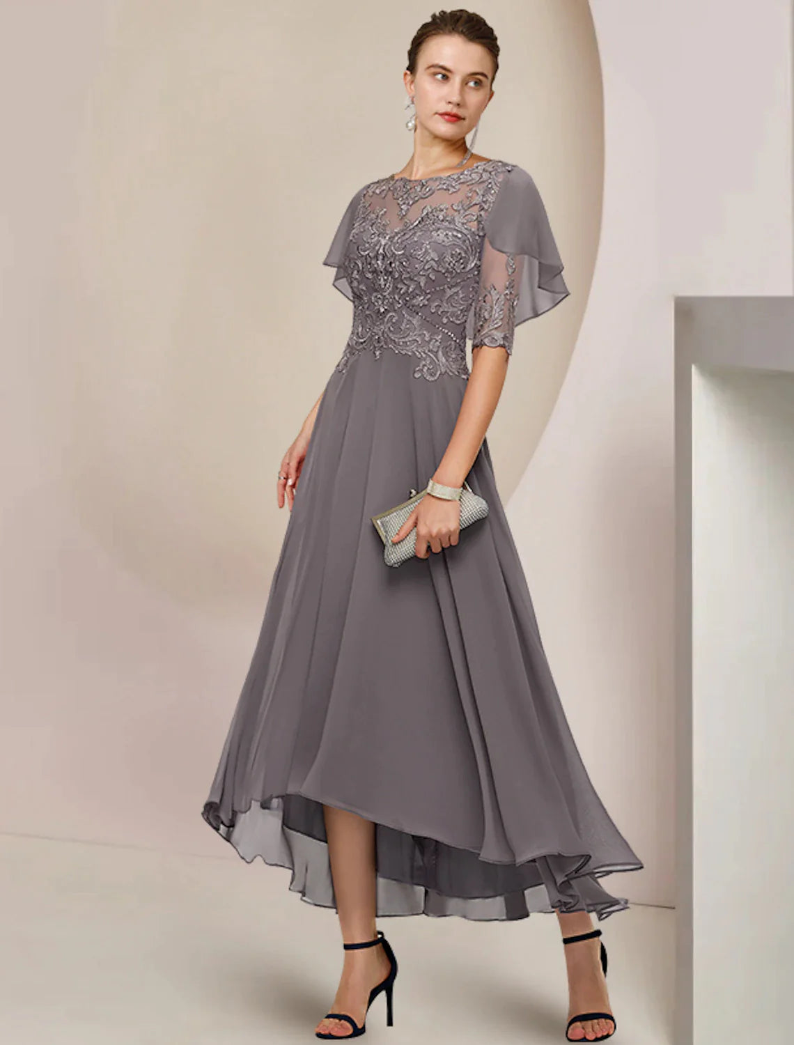 Elegant A-Line Mother of the Bride dress with scoop neck and half sleeves.