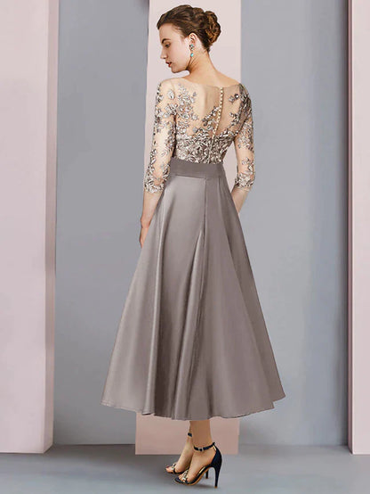 Side view of the tea length satin and lace dress with bow appliques.
