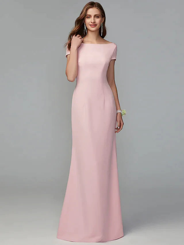 Model wearing an elegant A-line scoop neck jersey bridesmaid dress with a criss-cross open back.