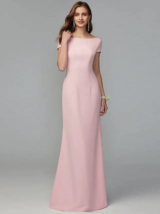 Model wearing an elegant A-line scoop neck jersey bridesmaid dress with a criss-cross open back.