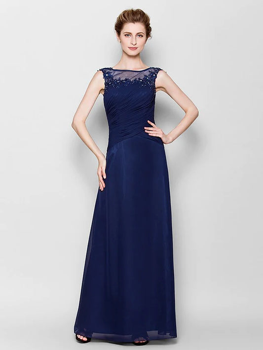 Elegant navy blue Mother of the Bride chiffon gown with scoop neck and sheer bodice.