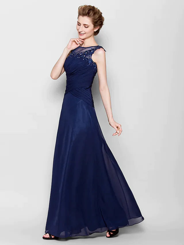 Back view of the navy blue Mother of the Bride dress showing criss-cross appliques.