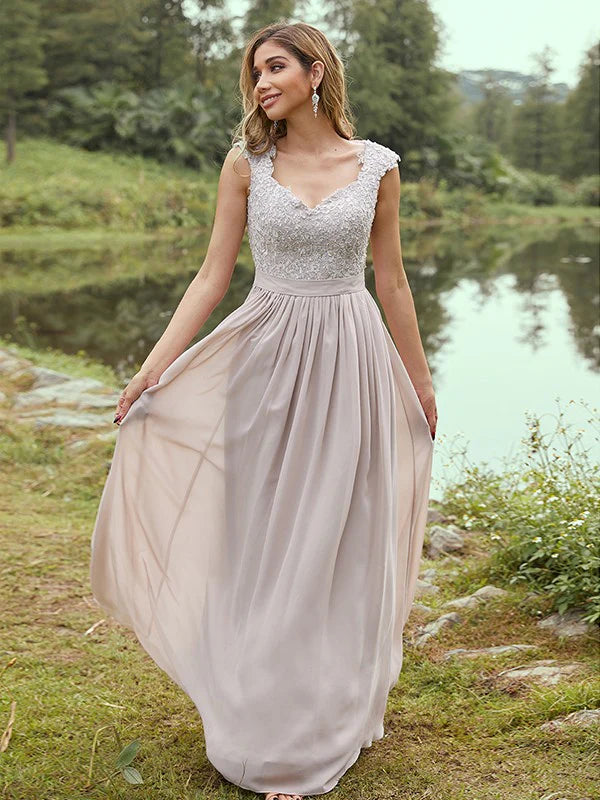 Front view of an elegant A-line chiffon bridesmaid dress with scoop neck, short sleeves, and delicate applique.