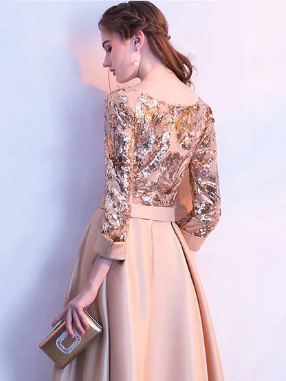 Side view of a woman wearing a floor-length sequin evening gown.