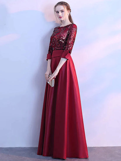 Woman in a sequin prom dress, showing the flow of the A-line skirt.