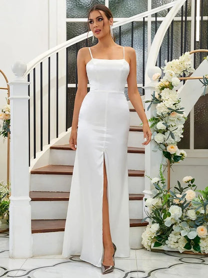 Front view of a woman wearing an A-line spaghetti strap bridesmaid dress.