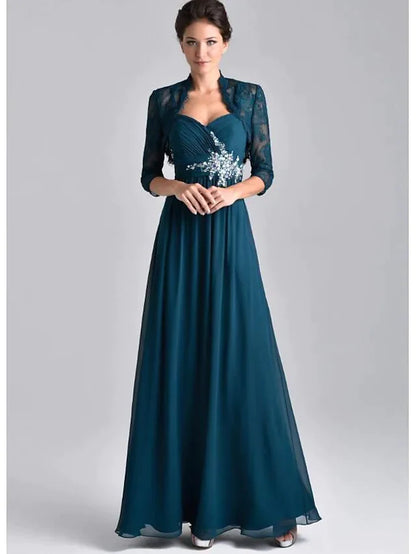 Model wearing an elegant two-piece A-line mother of the bride dress with spaghetti straps, 3/4 sleeves, lace, and embroidery.