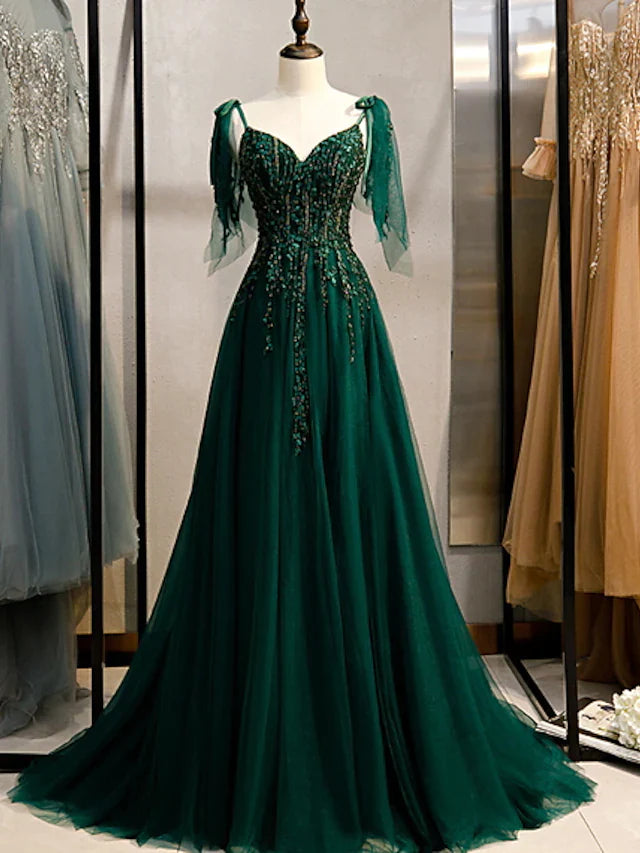 Woman in the elegant A-line formal evening dress, side profile, highlighting the silhouette.