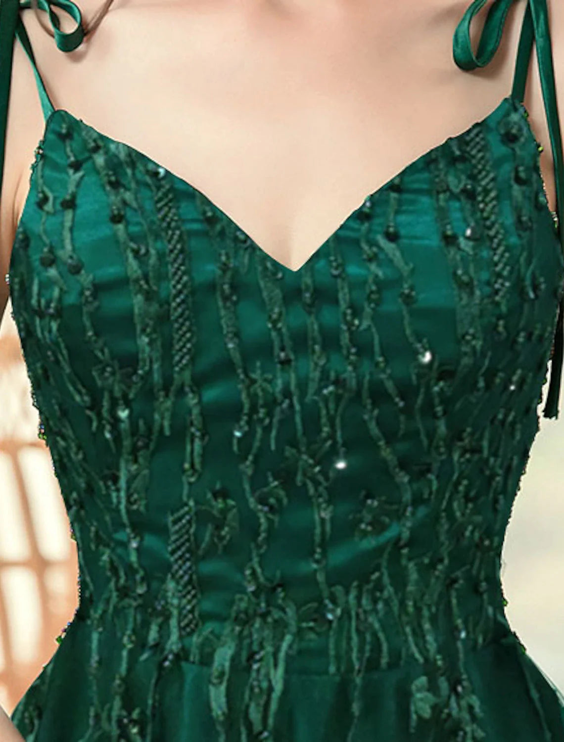 Back view of the A-Line formal dress showcasing the sweep train and delicate straps.