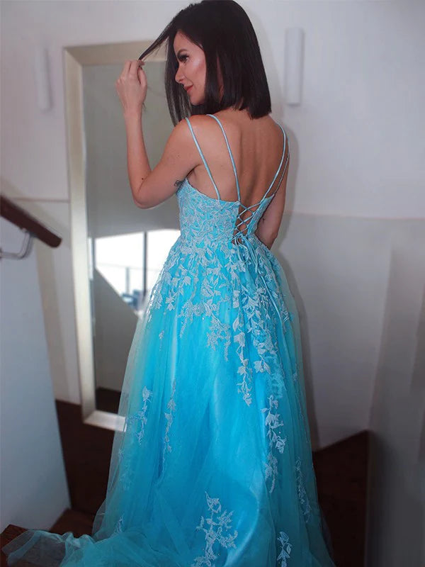 Side view of the flowing light blue tulle skirt on the A-line prom dress.