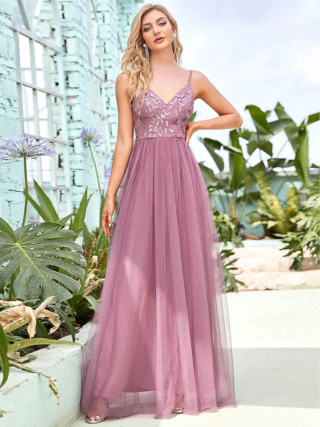 Back view of the A-line spaghetti strap floor-length bridesmaid dress, showing the tiered skirt.