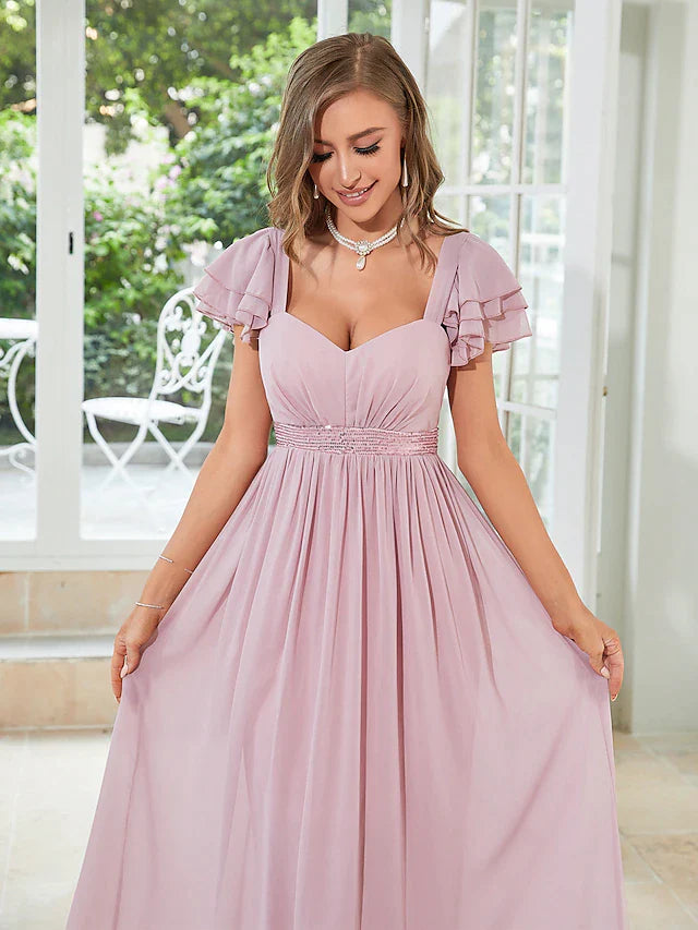 Close-up of the square neck and ruffled short sleeves on the light blue chiffon dress.
