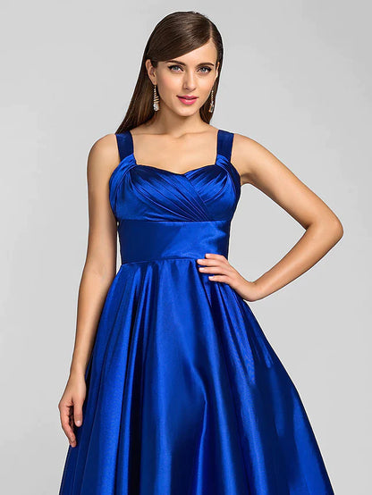 Woman posing gracefully in a stretch satin A-line dress.