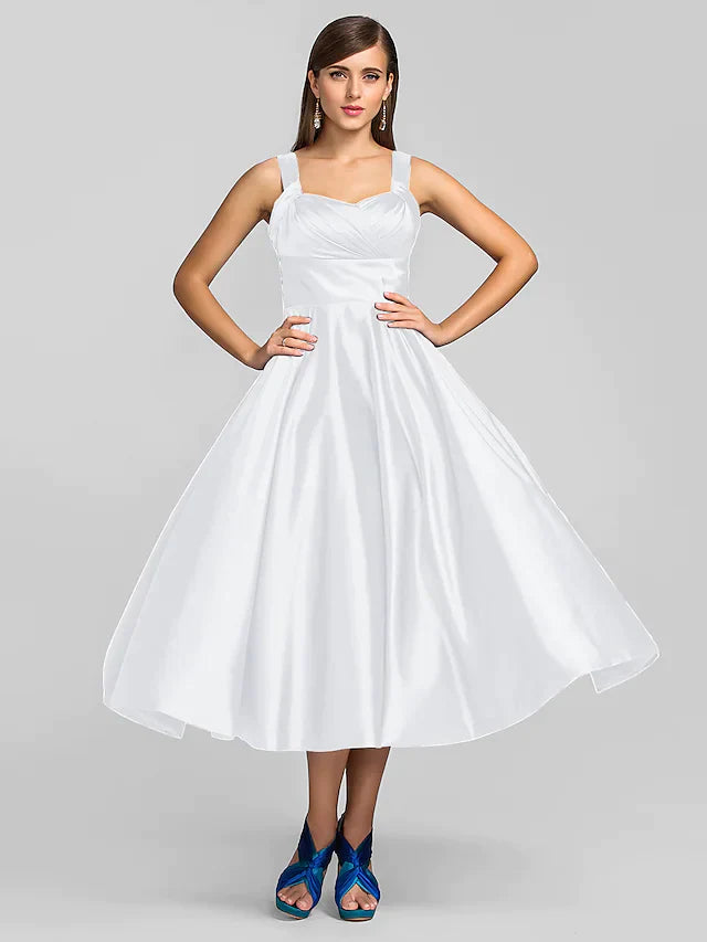 Full length view of the elegant A-line tea length dress.