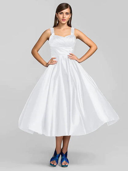 Full length view of the elegant A-line tea length dress.