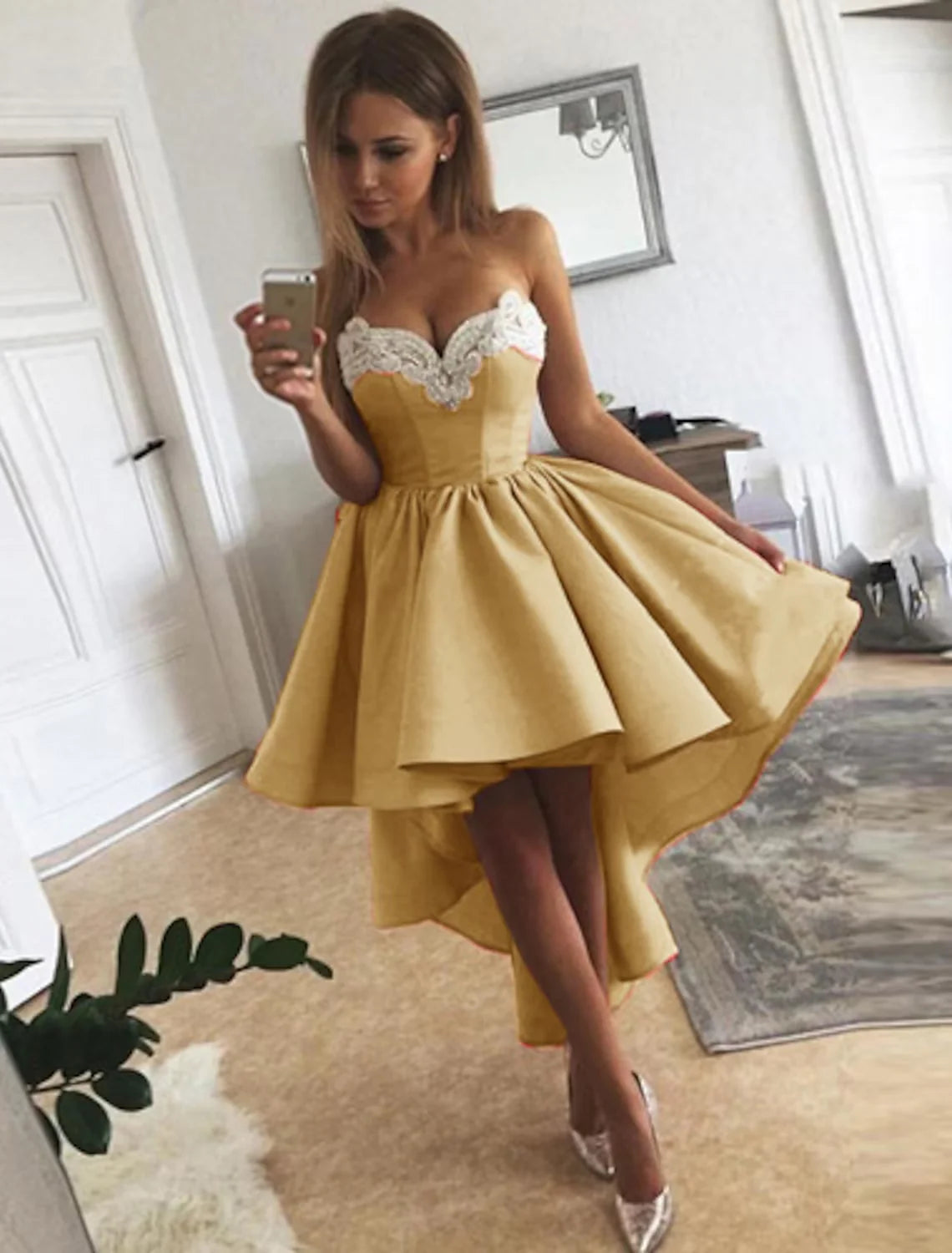 Side view of an A-line strapless satin homecoming dress with delicate appliques.