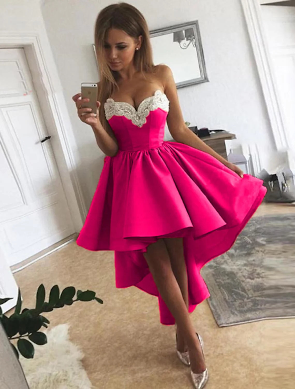 Back view of a sophisticated A-line strapless satin dress featuring appliques.