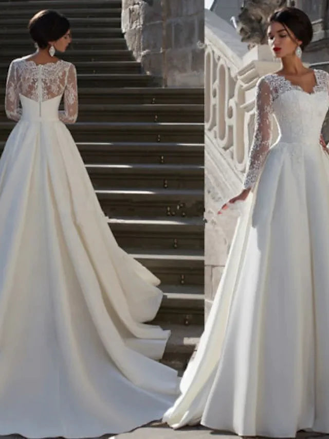 Back view of the A-line wedding dress, showcasing the court train and delicate lace details.