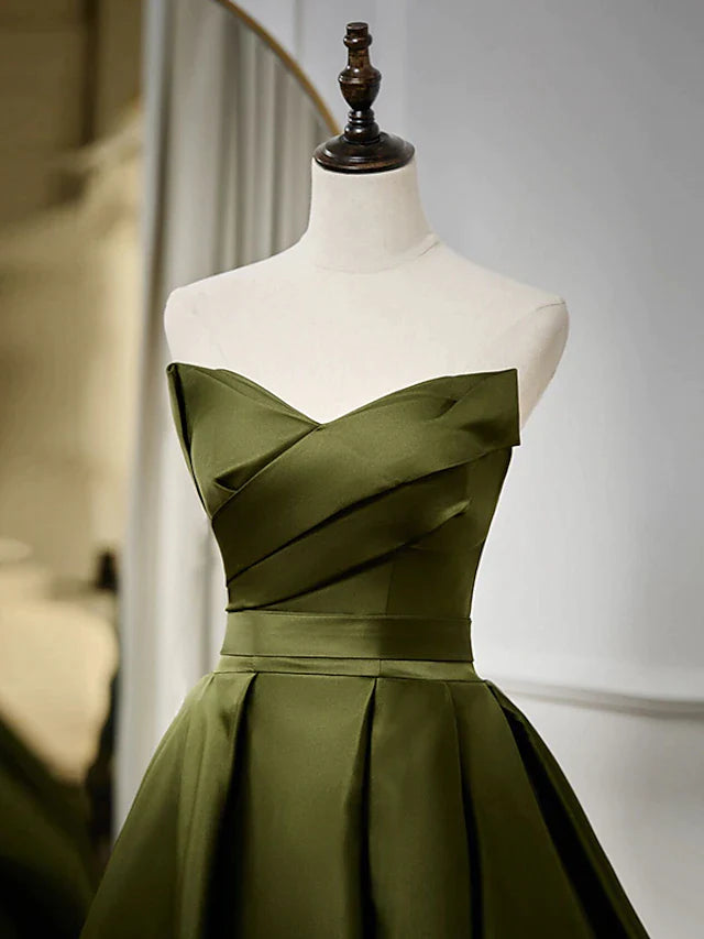 Back view of a strappy A-line strapless satin evening gown.