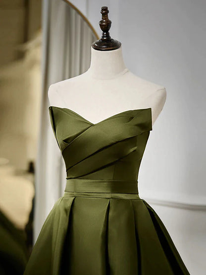 Back view of a strappy A-line strapless satin evening gown.