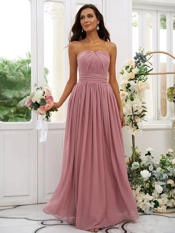 Elegant A-line strapless chiffon bridesmaid dress in light blue with ruffled details.