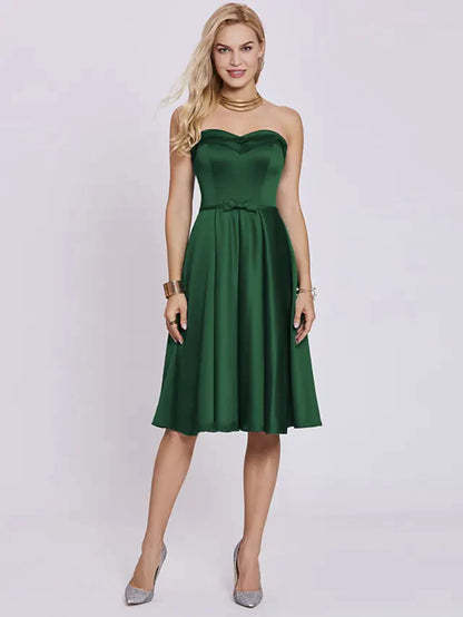 Side profile of a woman wearing a knee-length A-line satin party dress.