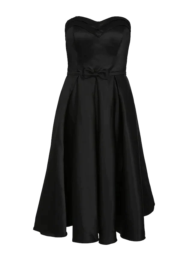 Close-up of the luxurious satin fabric and delicate pleats on the dress.