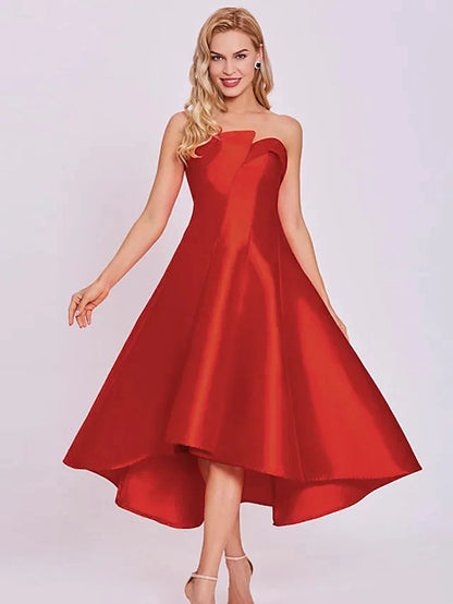 Model wearing an elegant A-line strapless tea-length satin cocktail dress.