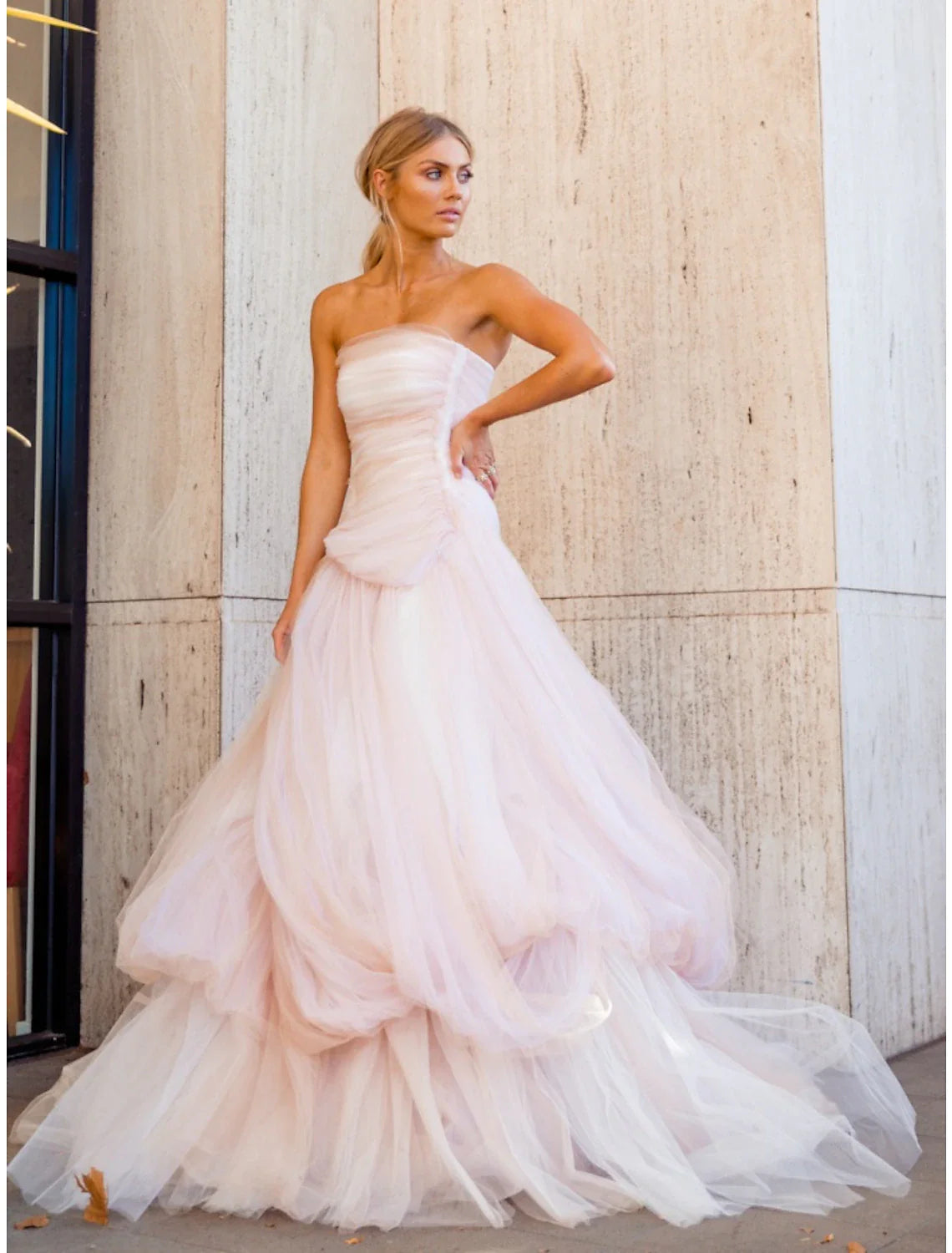 Close-up of the ruched and pleated details on the bodice of the A-line evening dress.