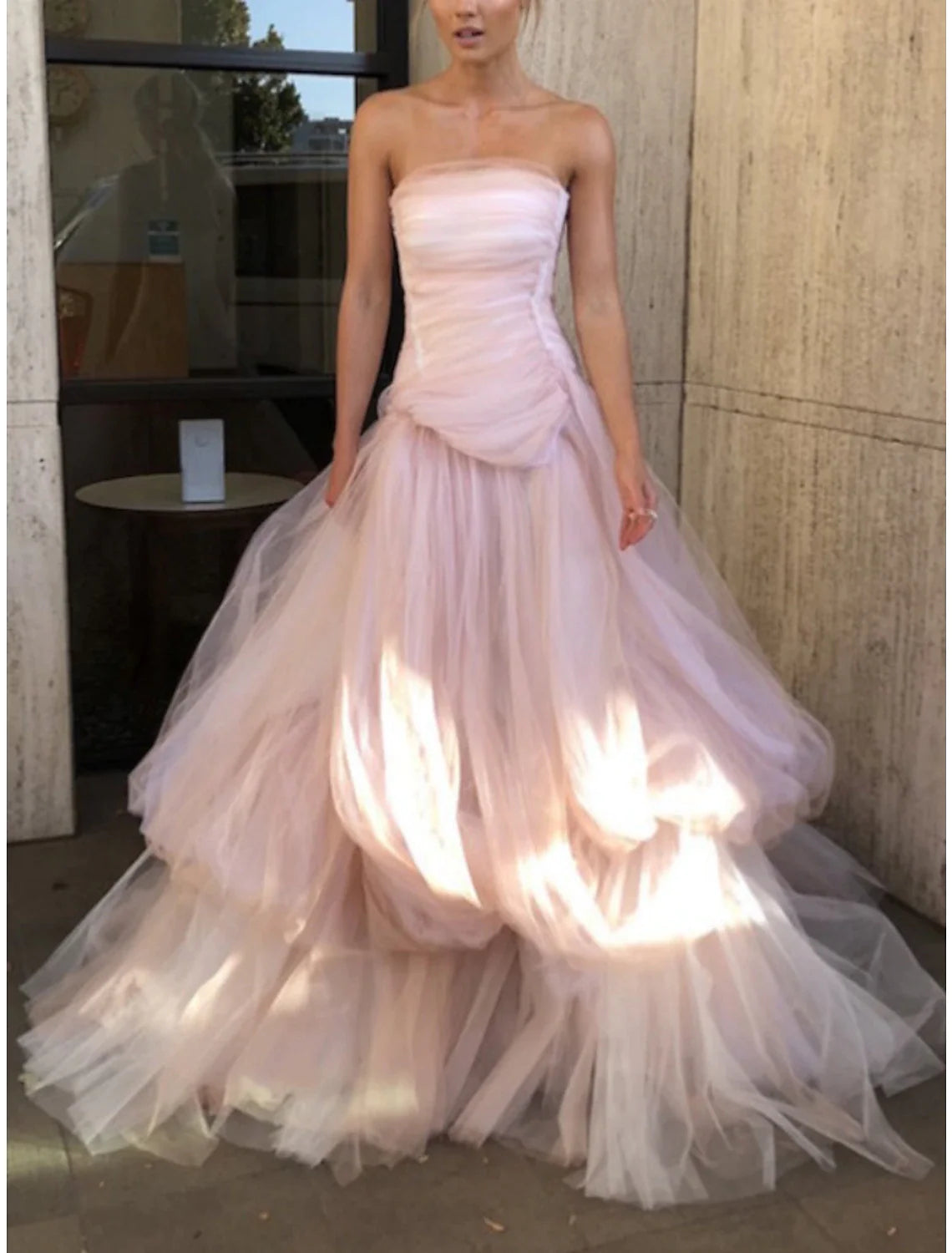 Another full-length view of the A-line strapless evening gown, showcasing its elegant silhouette and court train.
