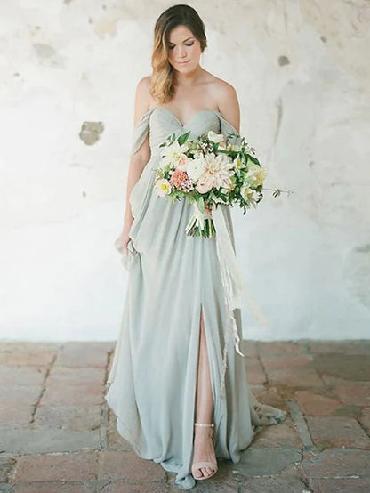 Woman wearing an elegant A-line sweetheart chiffon bridesmaid dress with pleats and a split front.