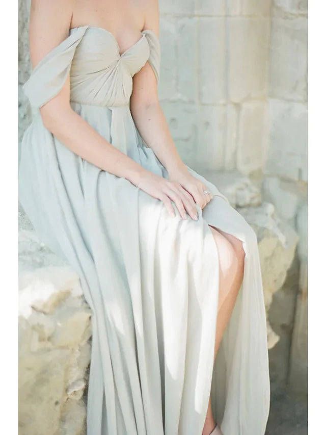 Side view of a woman showcasing the pleats and split front of the A-line bridesmaid dress.