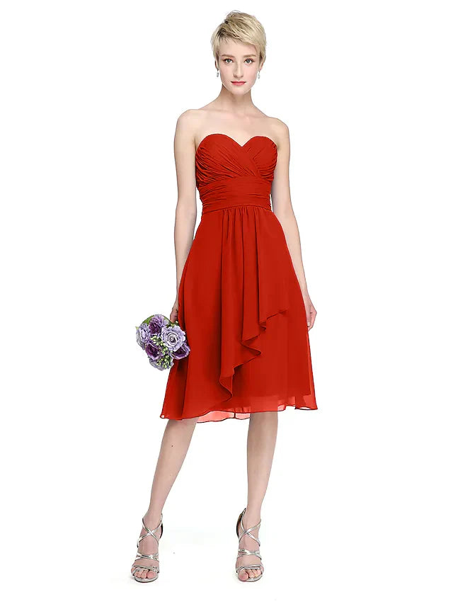 Side view of knee-length chiffon bridesmaid dress with elegant draping.