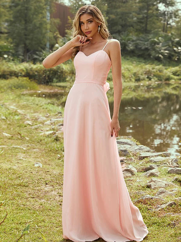 Elegant A-line sweetheart chiffon bridesmaid dress with a sash belt on a model.