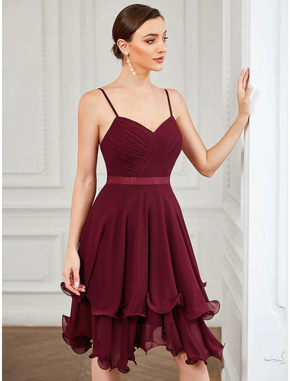 Model wearing an elegant pure color A-line short homecoming dress with a sweetheart neckline and tiered chiffon skirt.