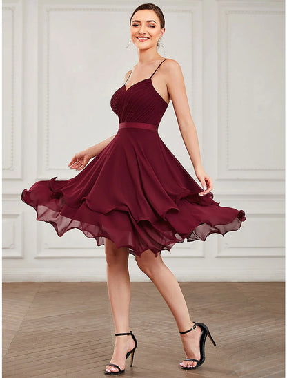 Back view of a model in a pure color A-line short homecoming dress, highlighting the sleeveless design.