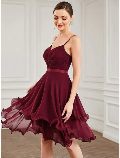 Close-up of the tiered chiffon fabric and sweetheart neckline on a pure color A-line homecoming dress.