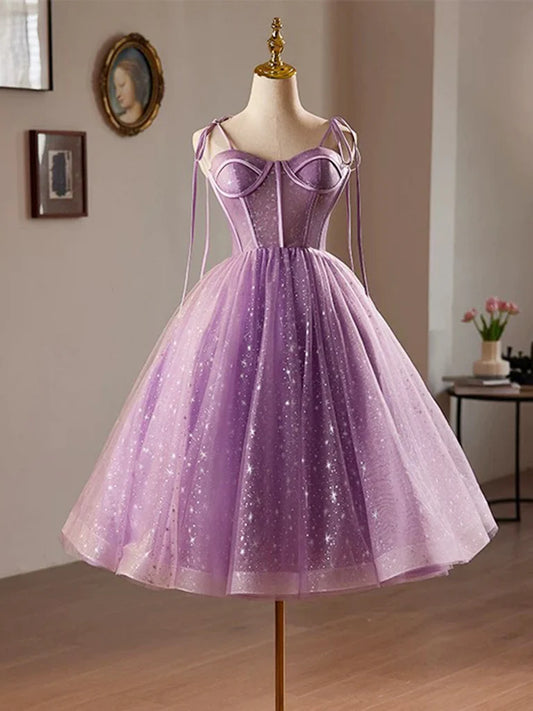 Model wearing an elegant purple A-line sweetheart neck tulle lace homecoming dress.