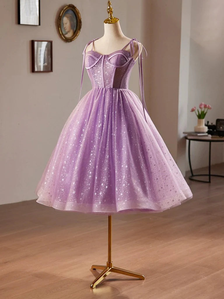 Model posing in a purple A-line sweetheart neck tulle lace dress for homecoming.