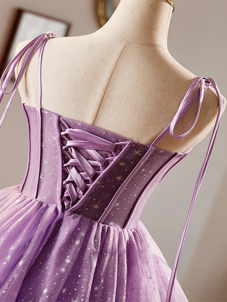 Close-up detail of the purple tulle and lace fabric on the A-line dress.