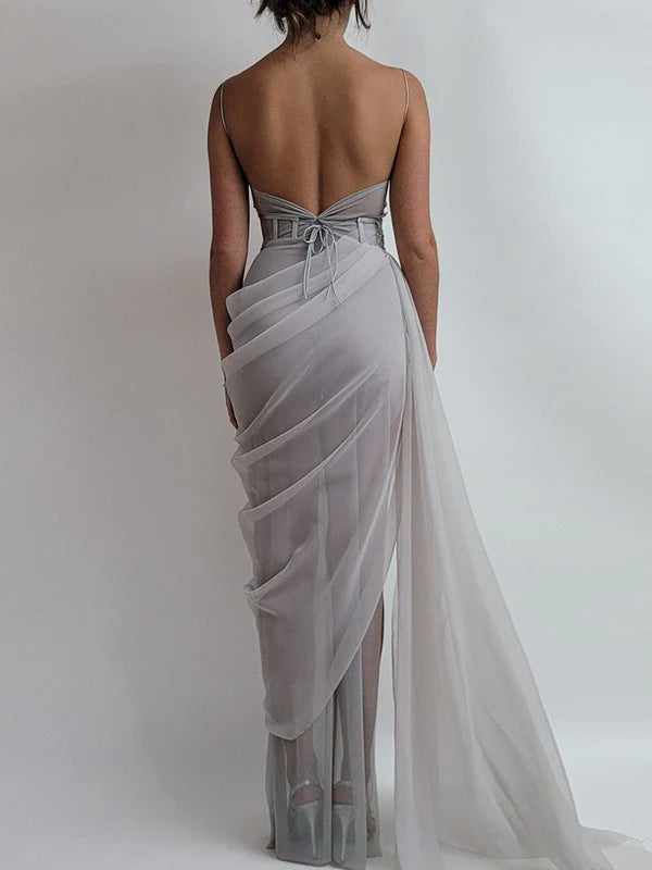 Back view of a flowing periwinkle organza A-line prom dress.