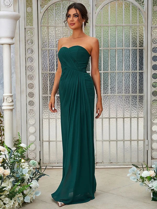 Back view of a light blue A-line chiffon bridesmaid dress with a flowing floor-length skirt.