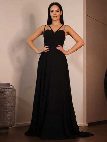 Full view of a black A-line prom dress featuring a sweetheart neckline and delicate ruffles.