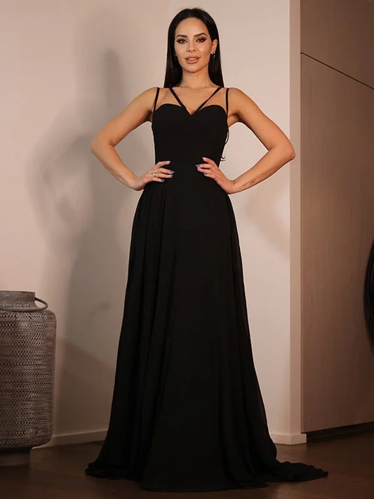 Full view of a black A-line prom dress featuring a sweetheart neckline and delicate ruffles.