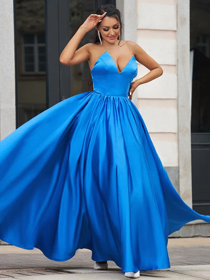 Blue A-Line prom dress with sweetheart neckline and ruffled details.