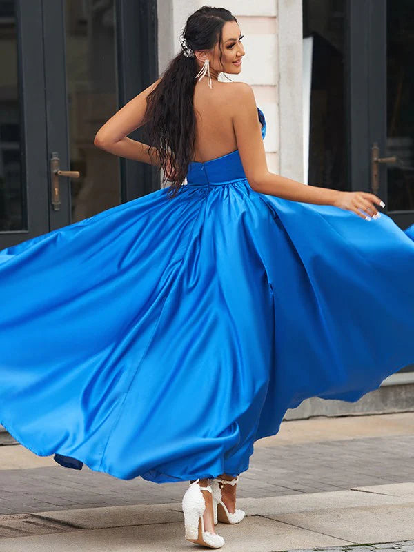 Back view of a blue satin A-Line prom dress with elegant ruffles.