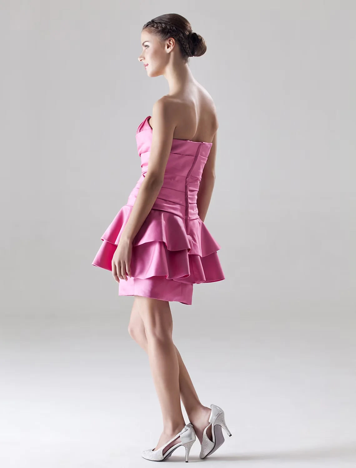 Back view of the A-line satin mini dress, showcasing the sleeveless design and side draping.