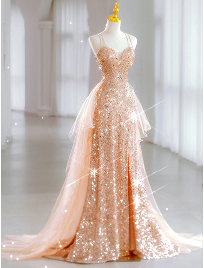Model posing in a light blue A-line sequin tulle floor-length dress.