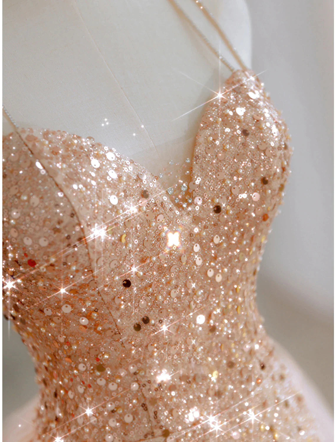Close-up of the sequin and tulle fabric on the A-line party dress.