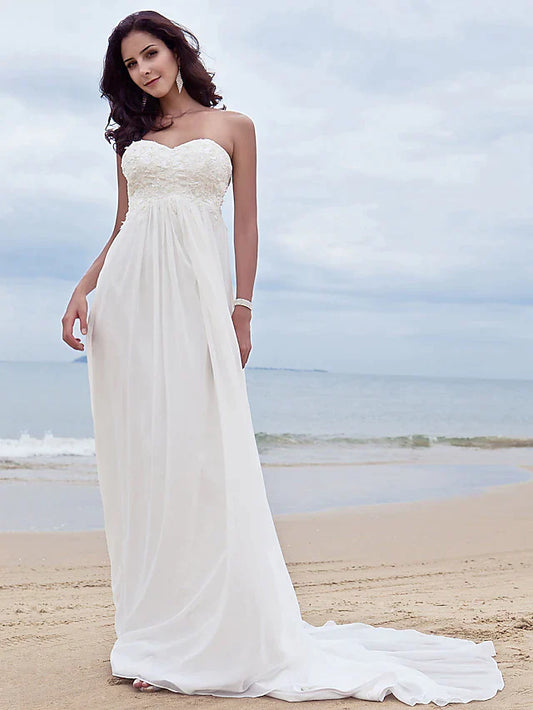 Full view of an A-line strapless chiffon wedding dress with sweetheart neckline and beading appliques.